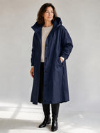 Theodora Hooded Longline Trench Coat in Navy on a 40+ model