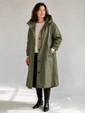 Theodora Hooded Longline Trench Coat in Olive on a 40+ model