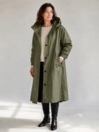 Theodora Hooded Longline Trench Coat in Olive on a 40+ model