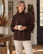 Dorothy knitted sweater in brown, worn in an autumn home