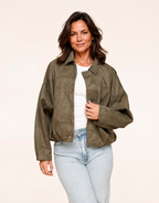 Fit mature woman wearing khaki faux-suede oversized bomber jacket, alternate front view