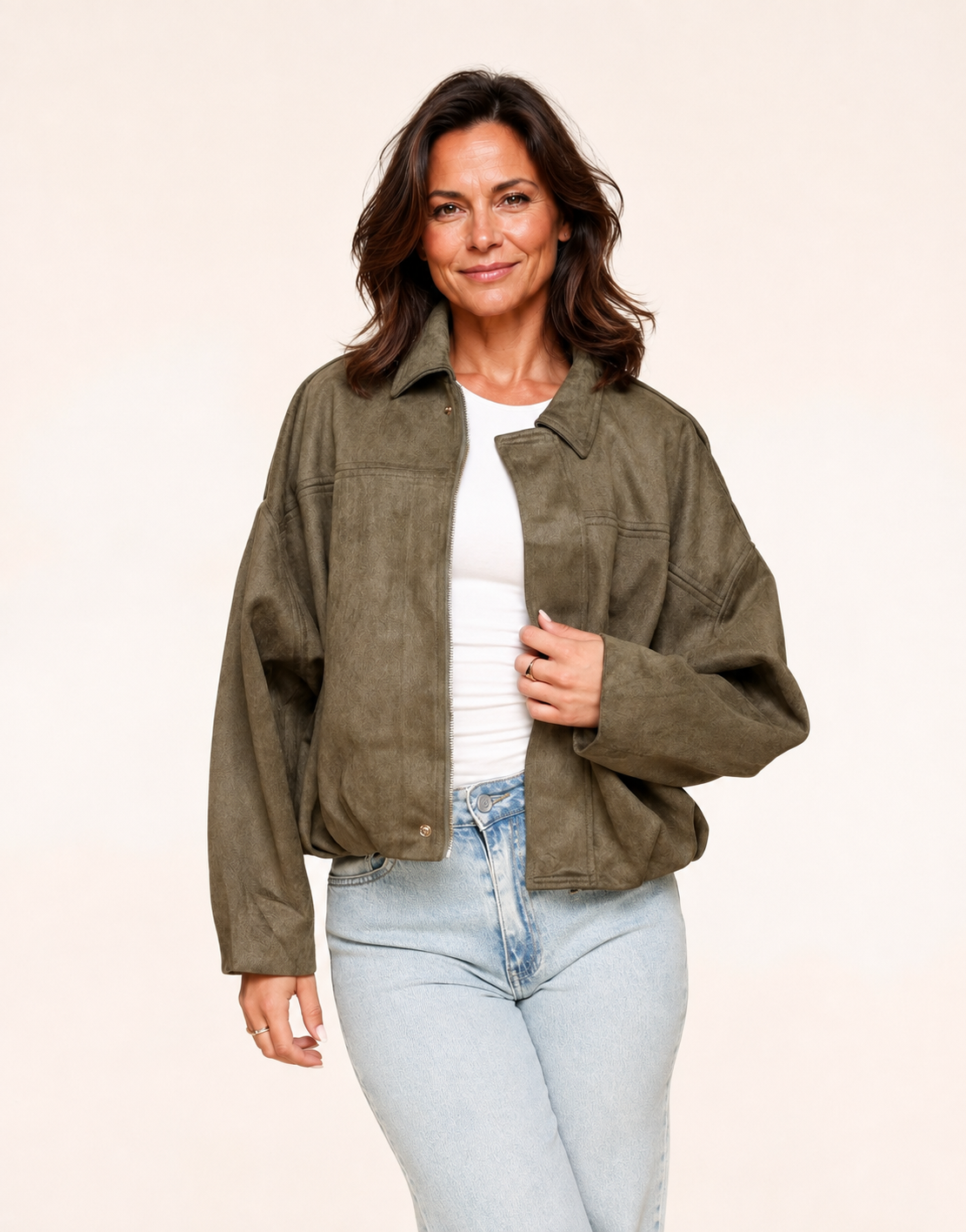 Fit mature woman wearing khaki faux-suede oversized bomber jacket, alternate front view