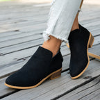 Marlowe comfort low-heel ankle boots in black, worn with cropped jeans, front view showing the V-cut ankle