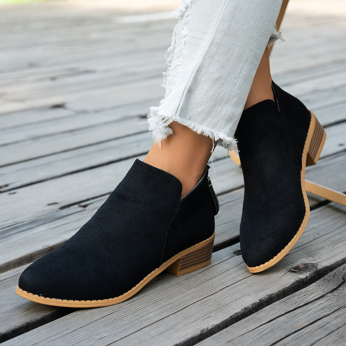 Marlowe comfort low-heel ankle boots in black, worn with cropped jeans, front view showing the V-cut ankle