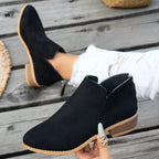 Marlowe comfort low-heel ankle boot in black, showing the V-cut ankle, back zip and low stacked heel