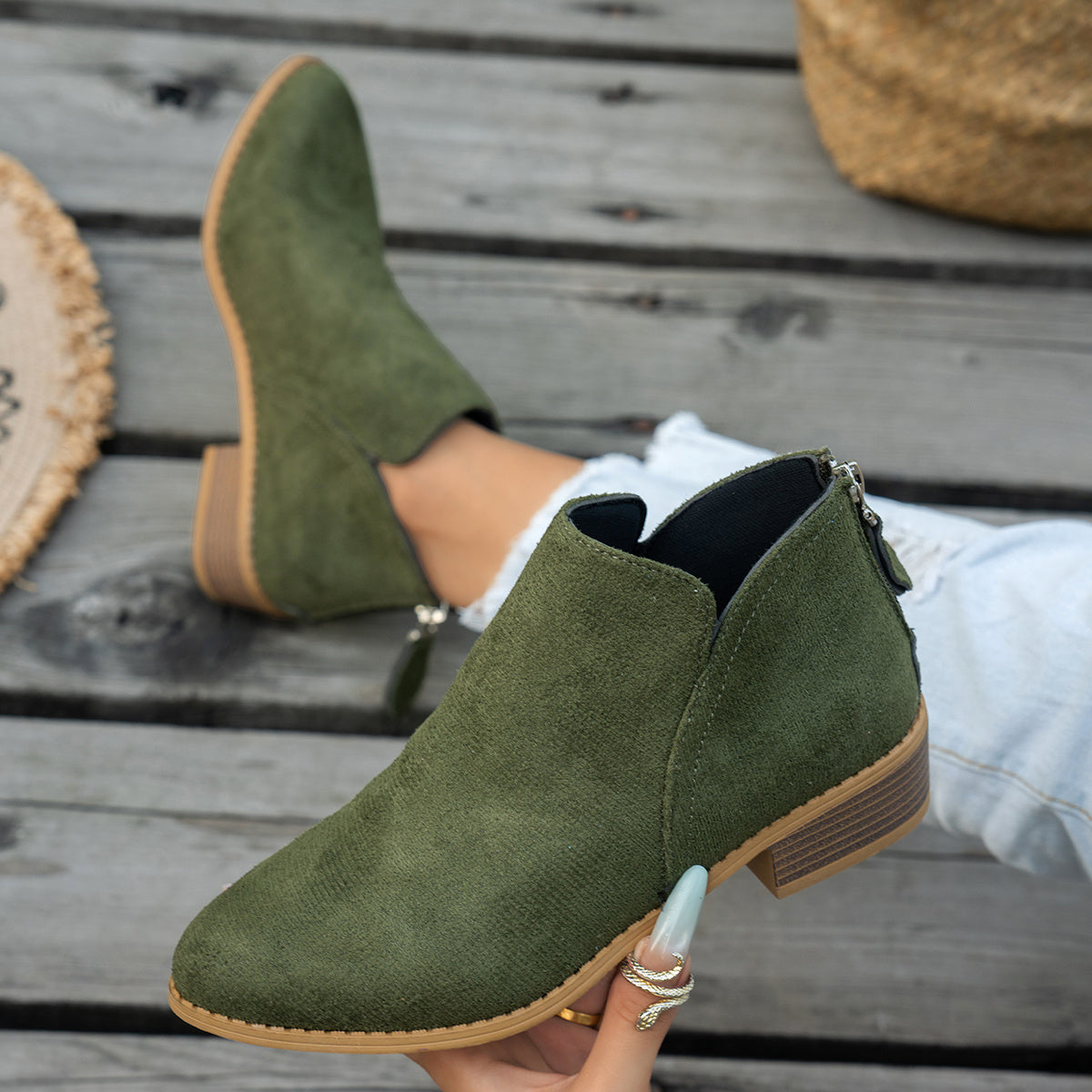 Marlowe comfort low-heel ankle boot in green, showing the V-cut ankle and low stacked heel