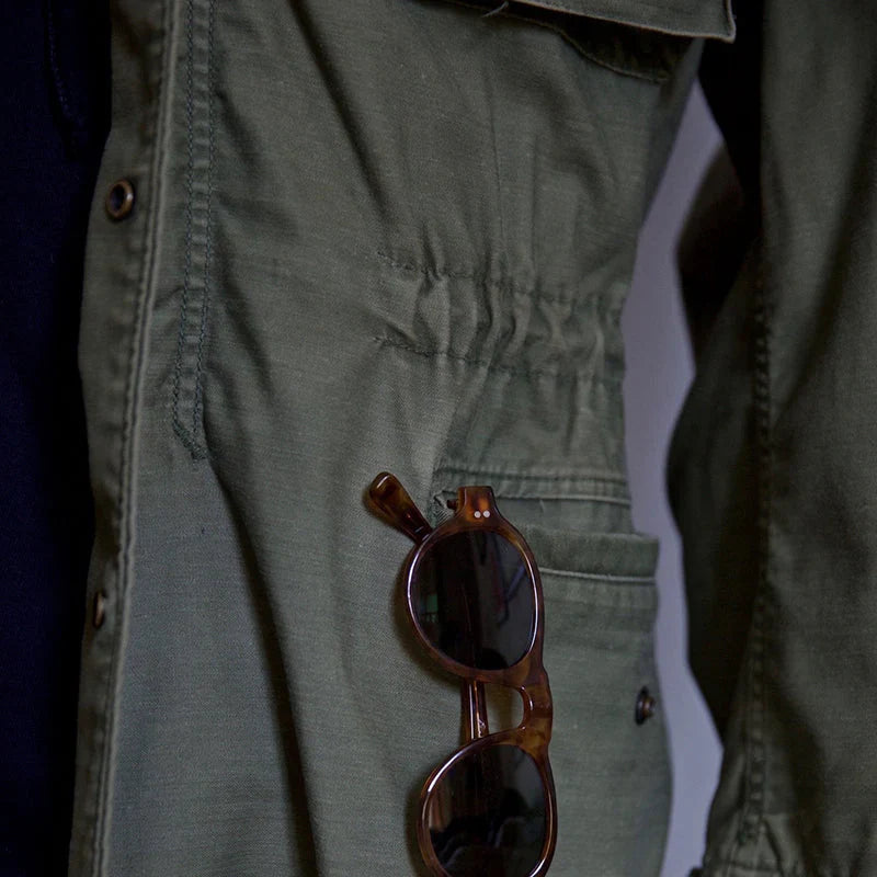 Close-up of the drawcord waist and lower flap pocket on the Mason field jacket