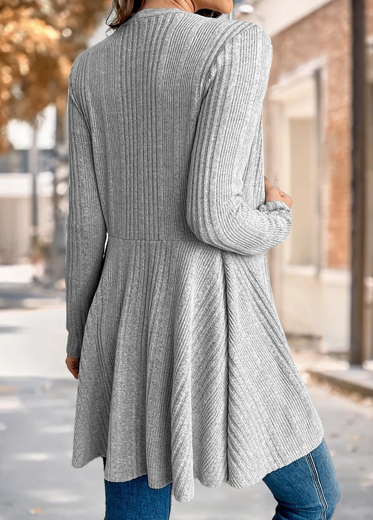Back view of the Nora comfort knit open front cardigan in grey, showing the waist seam and flared tunic length