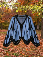 Vivienne butterfly wing cape cardigan in blue, shown open with the full wing pattern