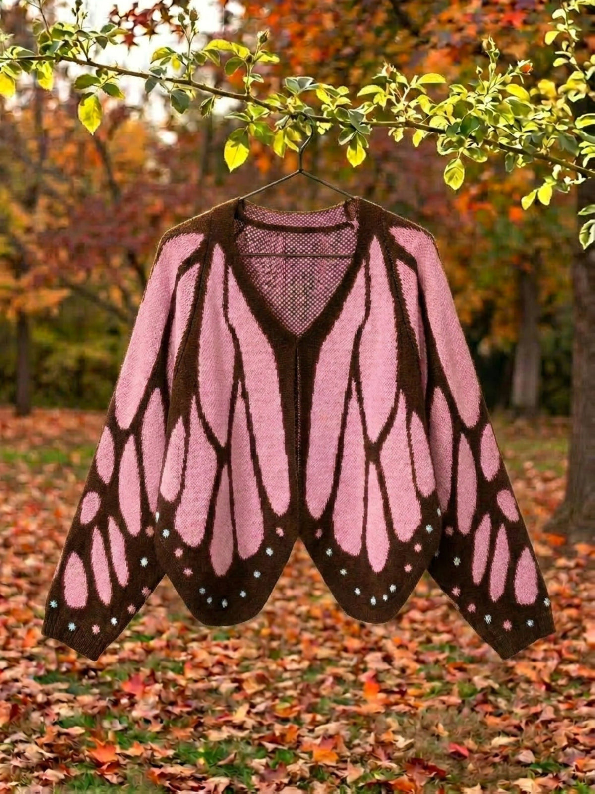 Vivienne butterfly wing cape cardigan in pink, shown open with the full wing pattern